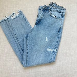 Light blue distress denim jeans